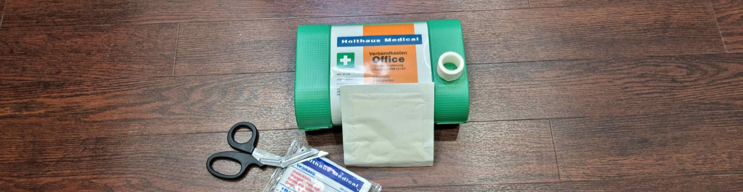 First aid kit with bandage and scissors
