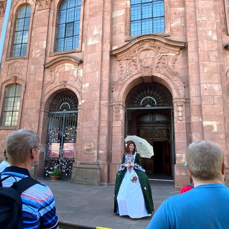 Court lady in front of the city church St. Alexander in Rastatt
