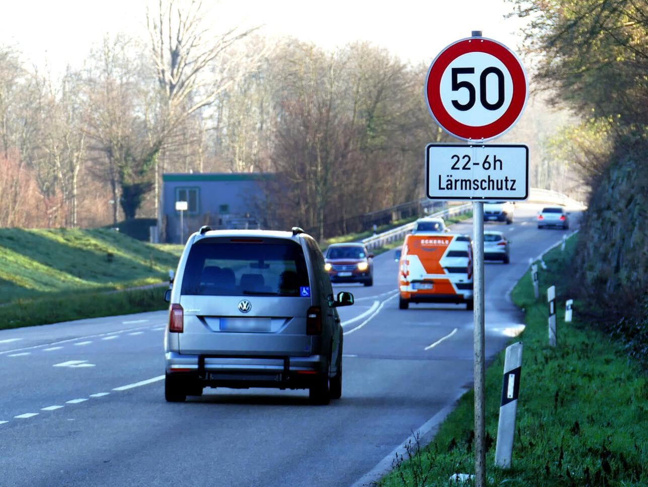 Street in Rastatt with cars, speed limit 50 and noise protection sign